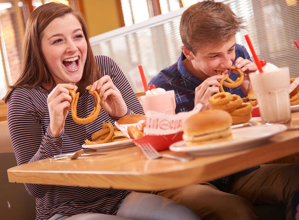 Frisch's Fundraising Nights Girl and Boy eating Onion Rings